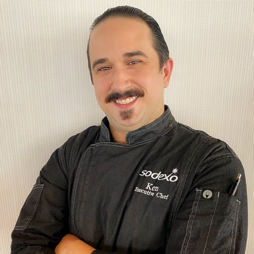 chef smiling with arms crossed